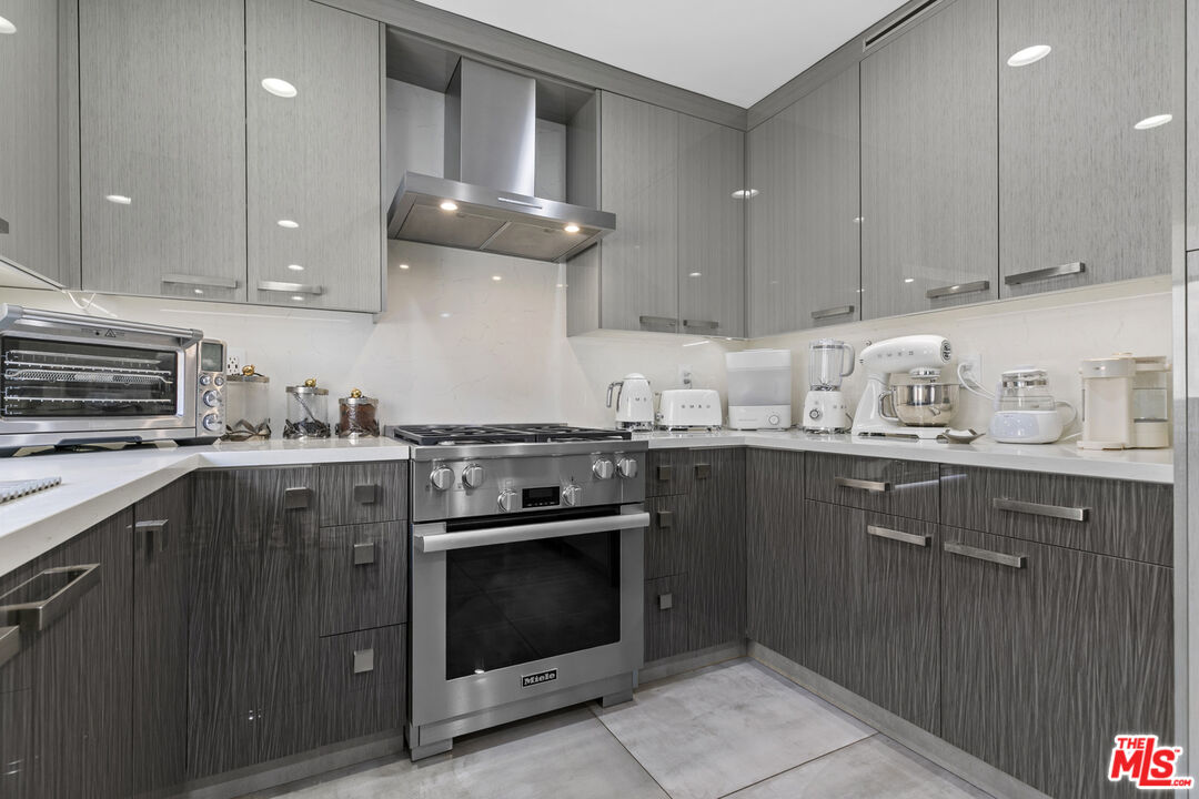 9772 Vía Roma Burbank, CA 91504 - Photo 12 of 44 a kitchen with a stove sink and cabinets