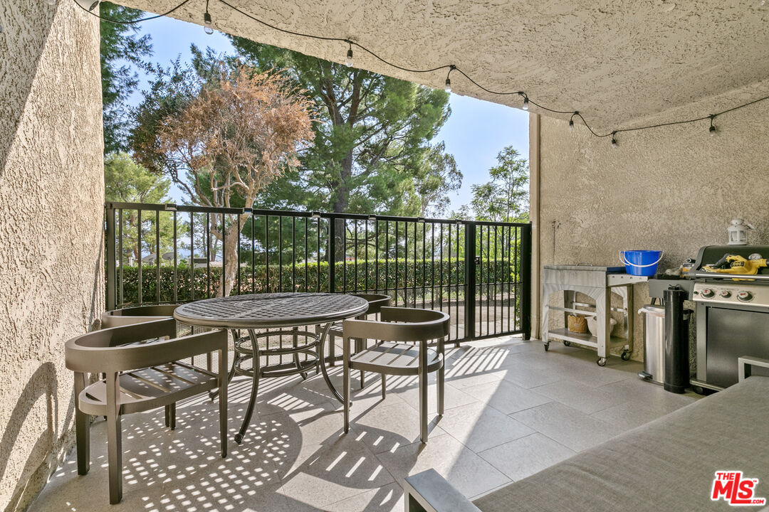 9772 Vía Roma Burbank, CA 91504 - Photo 15 of 44 a view of a balcony with chairs and iron fence