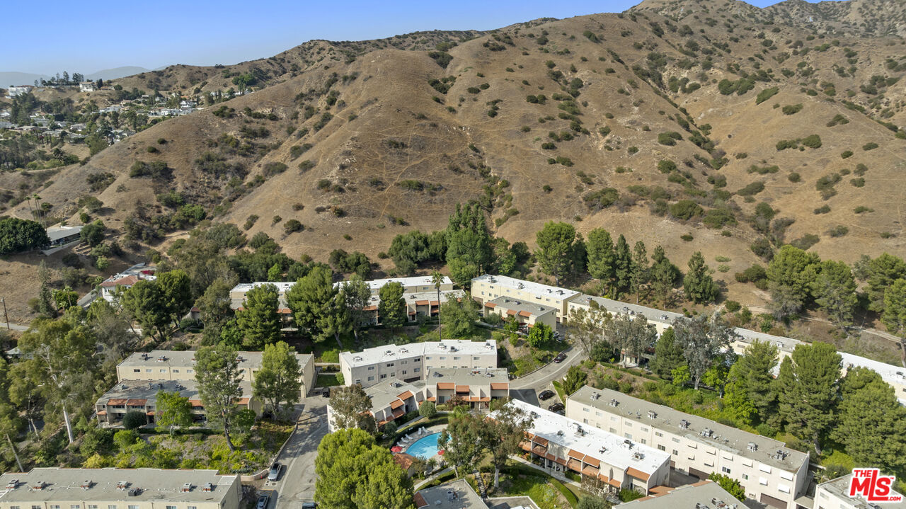 9772 Vía Roma Burbank, CA 91504 - Photo 42 of 44 a view of a large building with a mountain
