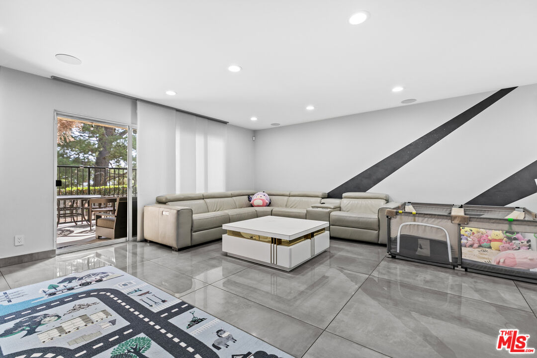 9772 Vía Roma Burbank, CA 91504 - Photo 7 of 44 a living room with furniture and a couch