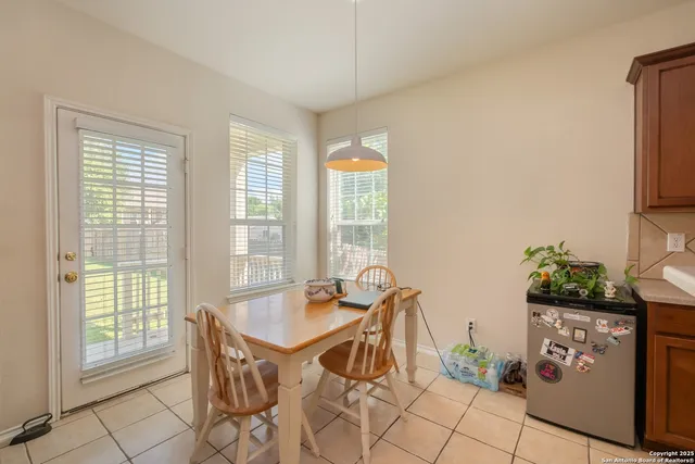 a dining room with furniture and window