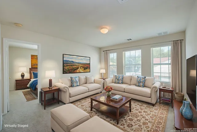 a view of an empty room with closet and a window