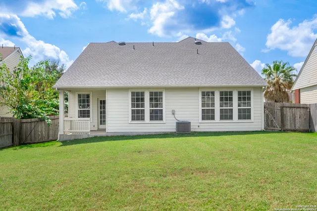 a view of a house next to a yard with a big yard