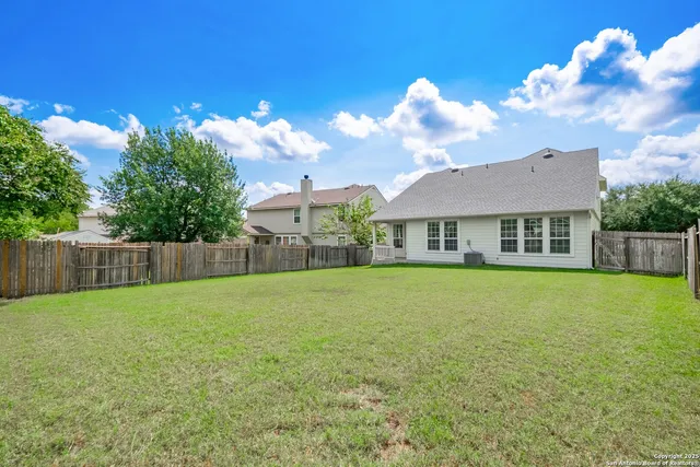 an aerial view of house with yard