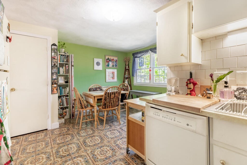 84 Lancaster Road, Unit 84 Dedham, MA 02026 - Photo 11 of 23 a kitchen with a sink and cabinets