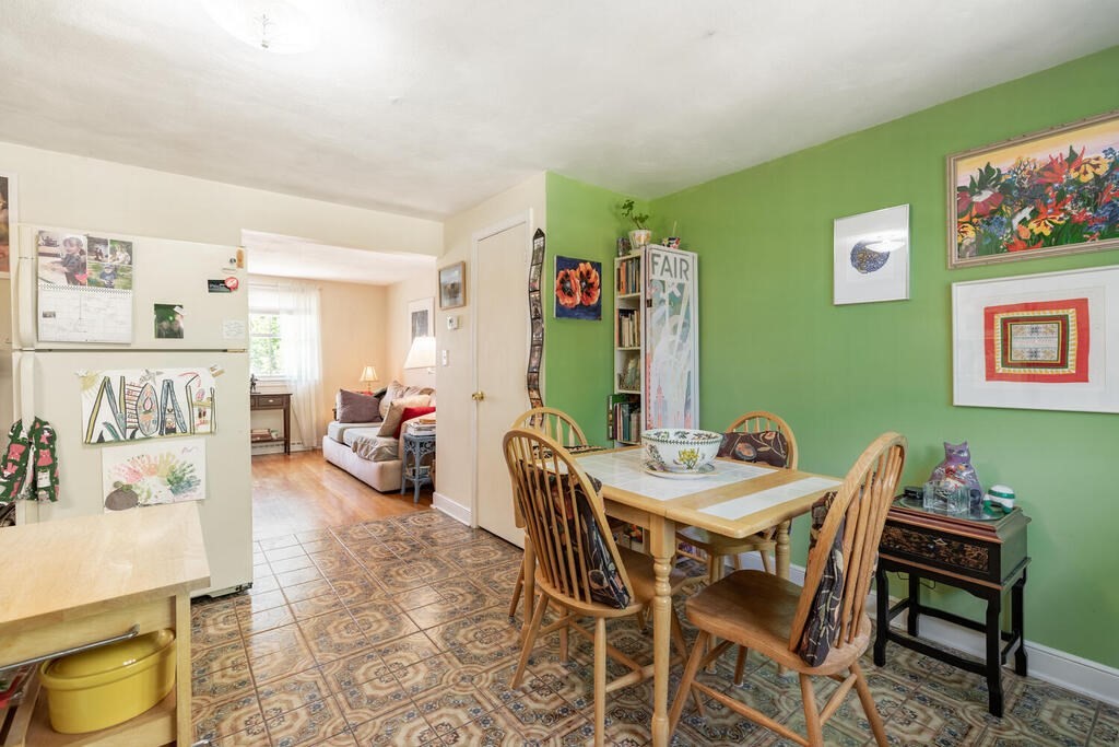 84 Lancaster Road, Unit 84 Dedham, MA 02026 - Photo 12 of 23 a view of a dining room with furniture and a kitchen
