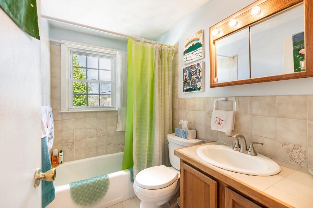 84 Lancaster Road, Unit 84 Dedham, MA 02026 - Photo 14 of 23 a bathroom with a sink a toilet and a bathtub