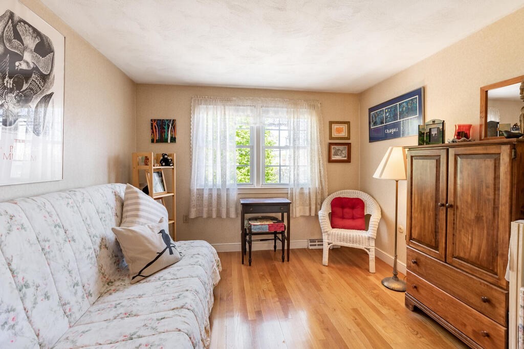 84 Lancaster Road, Unit 84 Dedham, MA 02026 - Photo 16 of 23 a living room with furniture and a wooden floor