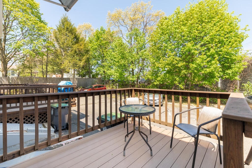 84 Lancaster Road, Unit 84 Dedham, MA 02026 - Photo 22 of 23 a view of a two chairs on deck with wooden floor