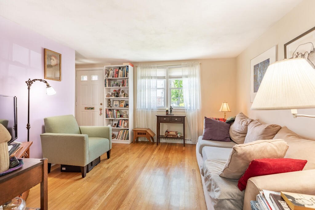 84 Lancaster Road, Unit 84 Dedham, MA 02026 - Photo 5 of 23 a living room with furniture and wooden floor