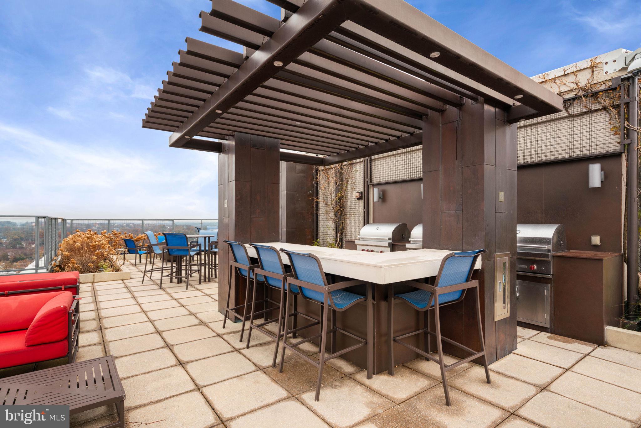 851 North Glebe Road, Unit 1011 Arlington, VA 22203 - Photo 36 of 41 a view of a dinning table and chairs in the patio