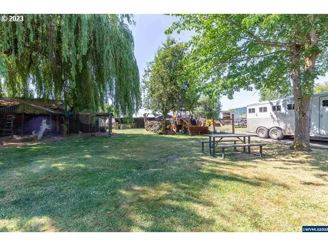 a view of a house with a yard porch and sitting area