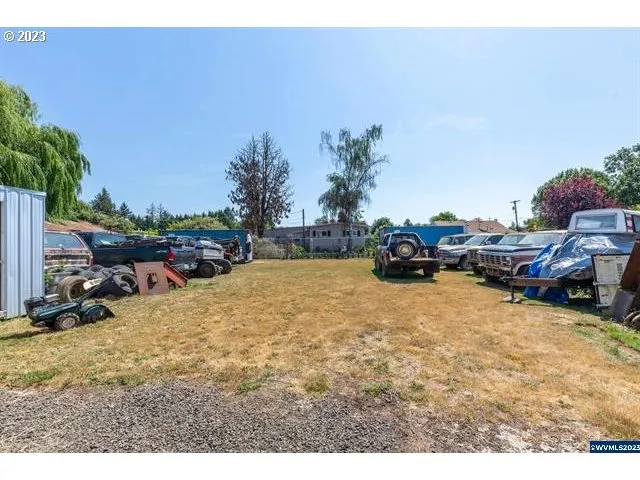 a view of outdoor space with deck and car parked