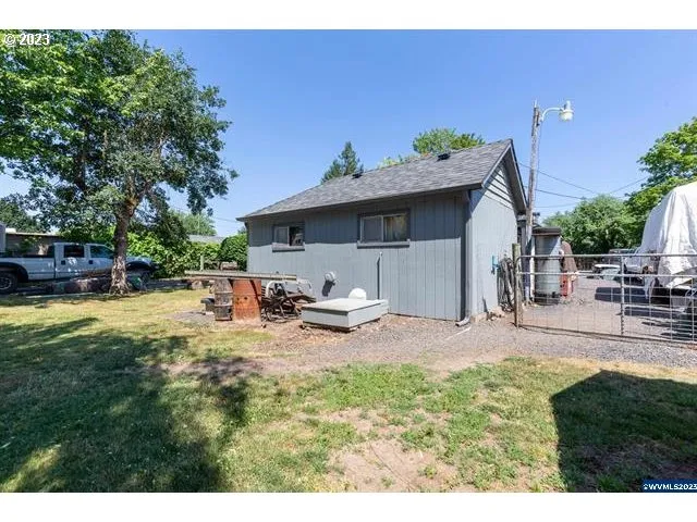 a view of a backyard with sitting area