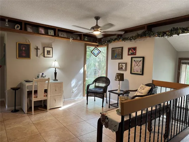 a view of a livingroom with furniture and windows