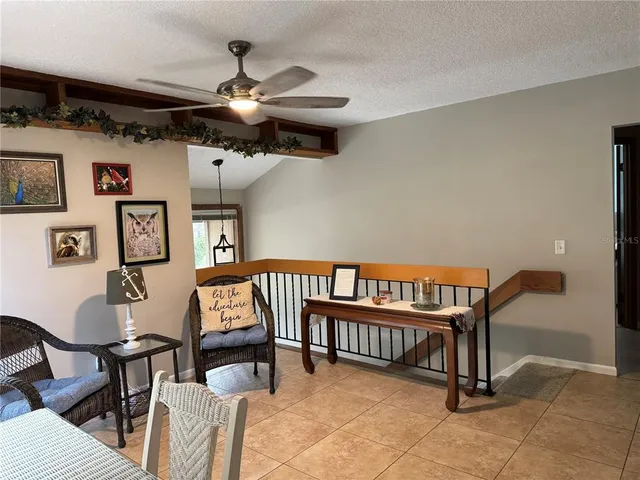 a dining room with furniture and window