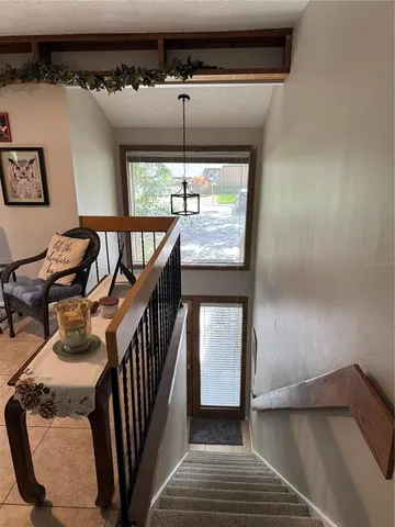 a kitchen with kitchen island a sink appliances and a counter top space