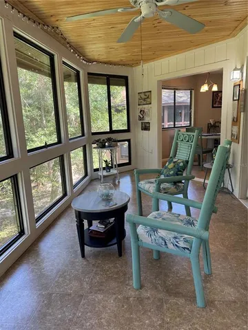 a view of a swimming pool with a patio