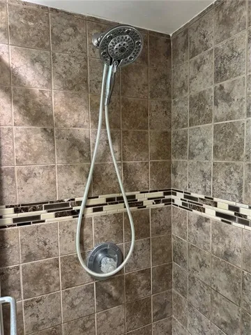 a bathroom with a granite countertop toilet sink and tub