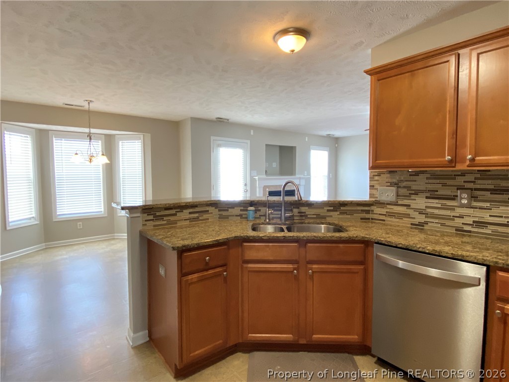 58 Polk Street Spring Lake, NC 28390 - Photo 7 of 26 a kitchen with a sink and cabinets