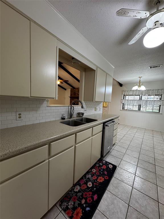 3205 Pin Oak Drive Temple, TX 76502 - Photo 12 of 30 a kitchen with stainless steel appliances a sink stove and cabinets