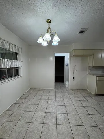 a view of a kitchen with a sink and cabinets