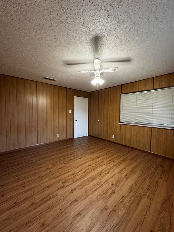 3205 Pin Oak Drive Temple, TX 76502 - Photo 15 of 30 a view of an empty room with wooden floor