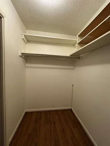 a view of an empty walk in closet