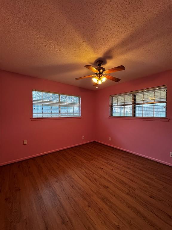 3205 Pin Oak Drive Temple, TX 76502 - Photo 26 of 30 a view of an empty room with a window and wooden floor