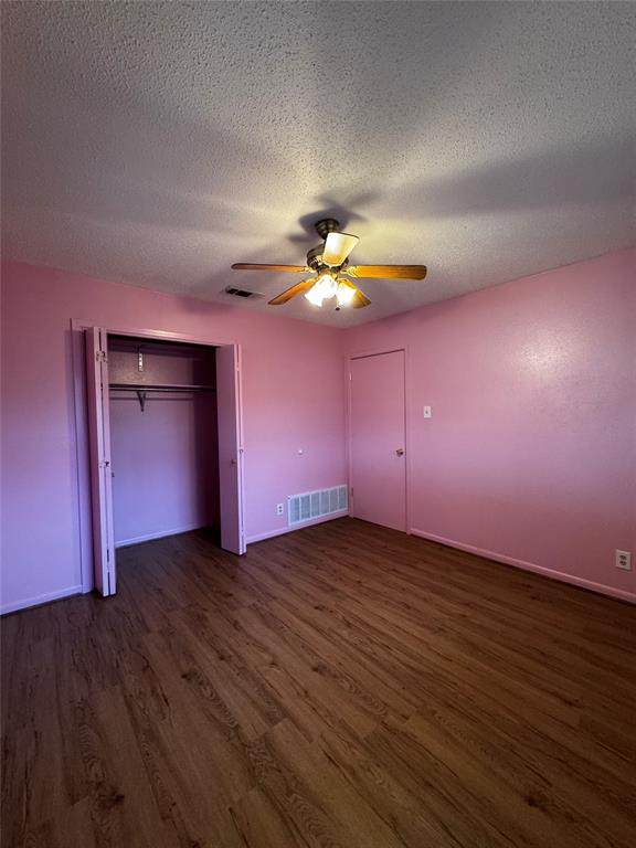 3205 Pin Oak Drive Temple, TX 76502 - Photo 27 of 30 a view of an empty room with a window and wooden floor