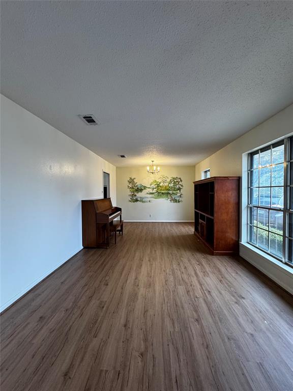 3205 Pin Oak Drive Temple, TX 76502 - Photo 3 of 30 wooden floor in an empty room with a window