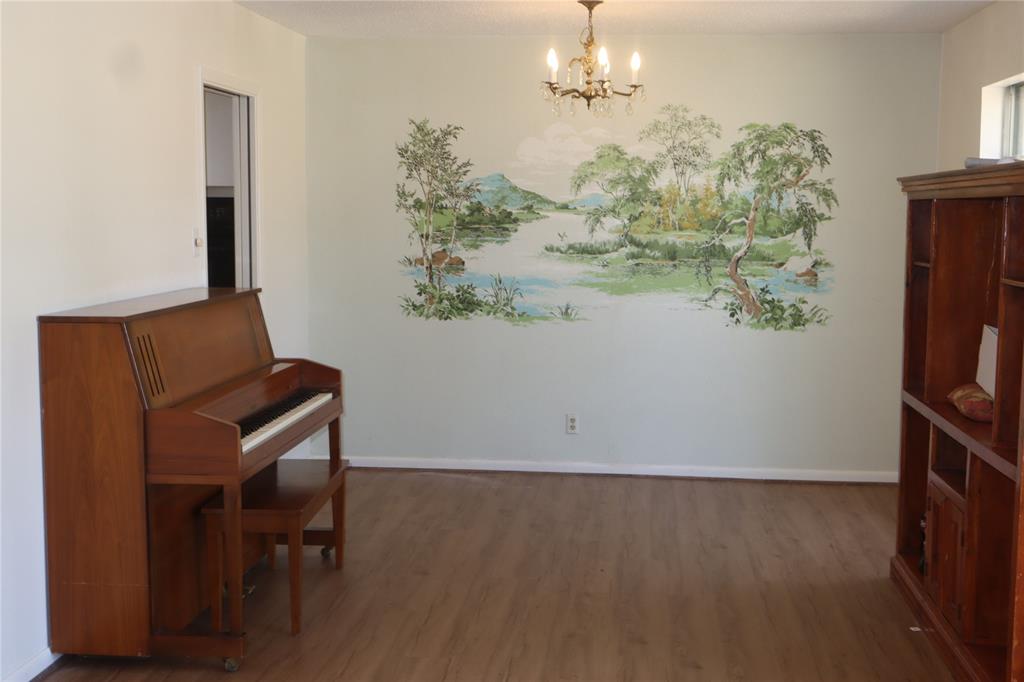 3205 Pin Oak Drive Temple, TX 76502 - Photo 6 of 30 a view of a room with furniture and a chandelier