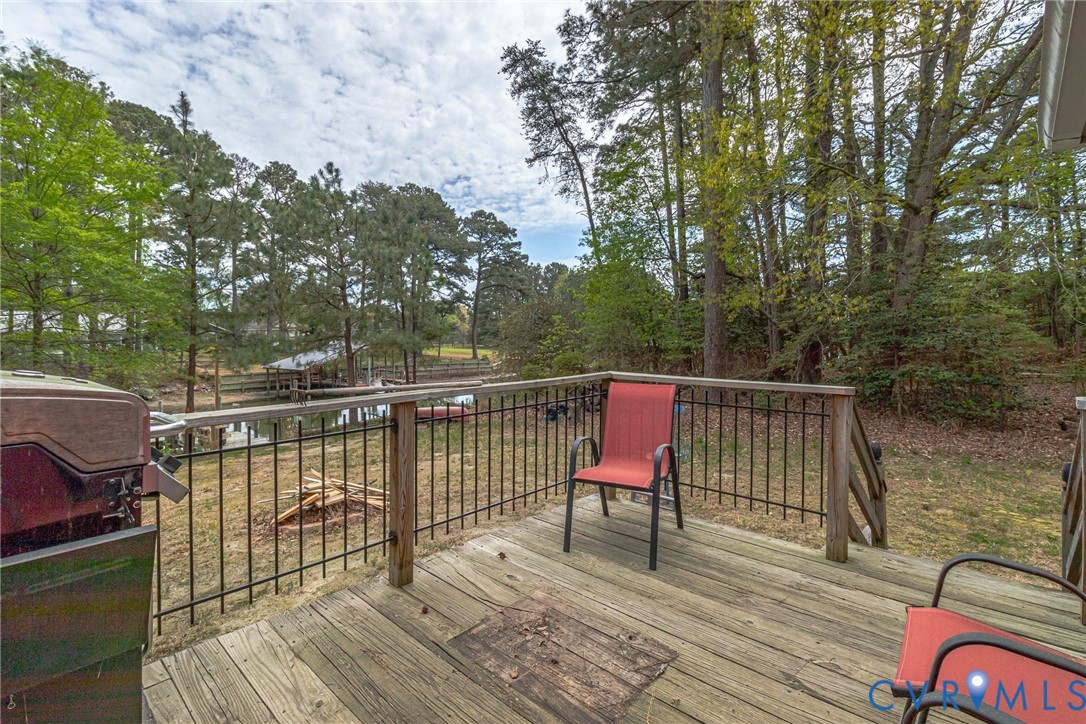 193 Deep Water Lane Reedville, VA 22539 - Photo 72 of 84 a view of a balcony with wooden floor and outdoor seating