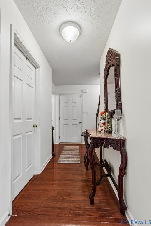 83 Albertson Court Ruther Glen, VA 22546 - Photo 24 of 25 Hallway featuring rich wood-finish flooring, white