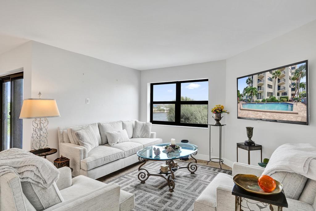 501 North Riverside Drive, Unit 203 Pompano Beach, FL 33062 - Photo 18 of 63 a living room with furniture and a window