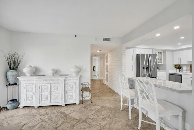 a bedroom with a bed and a large mirror