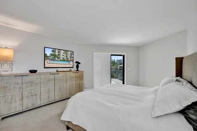 a bathroom with a double vanity sink a toilet and a mirror