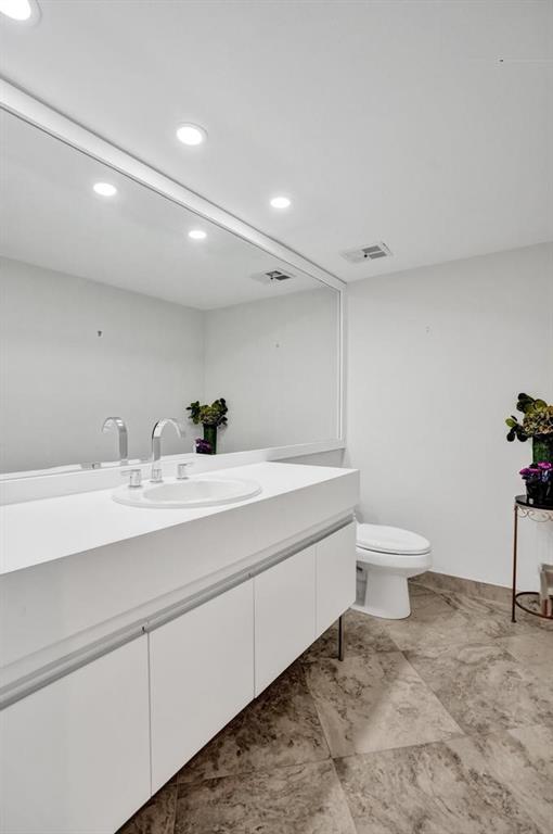 501 North Riverside Drive, Unit 203 Pompano Beach, FL 33062 - Photo 42 of 63 a bathroom with a sink and a toilet