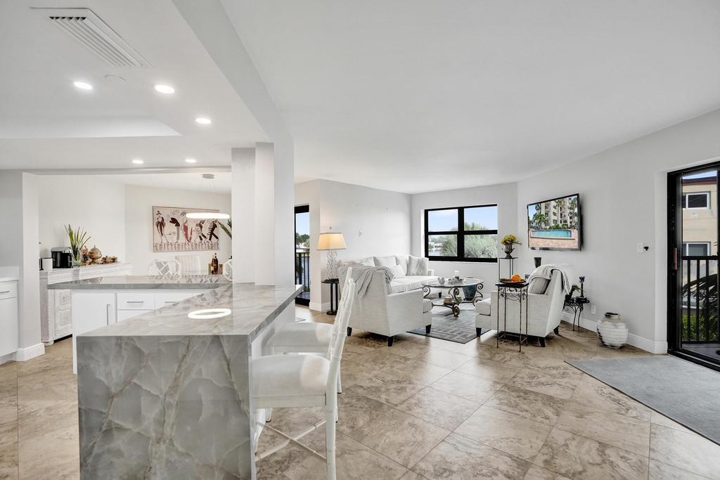 501 North Riverside Drive, Unit 203 Pompano Beach, FL 33062 - Photo 6 of 63 a living room with furniture and white walls