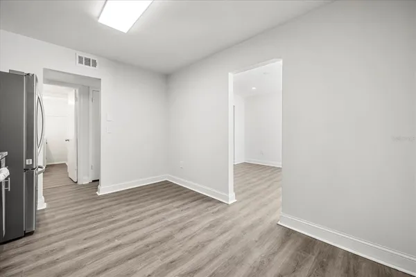 an empty room with wooden floor