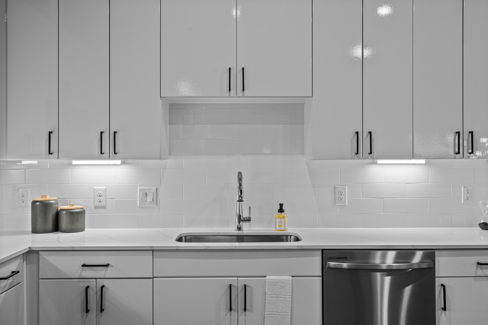 865 Limmer Loop, Unit 1105 Hutto, TX 78634 - Photo 13 of 32 a kitchen with a sink and cabinets