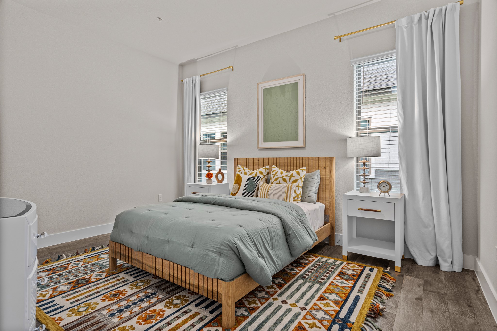 865 Limmer Loop, Unit 1105 Hutto, TX 78634 - Photo 15 of 32 a bedroom with a bed and a window