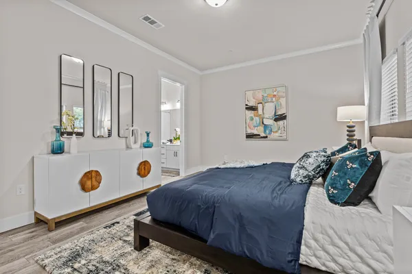 a bedroom with a bed and a dresser