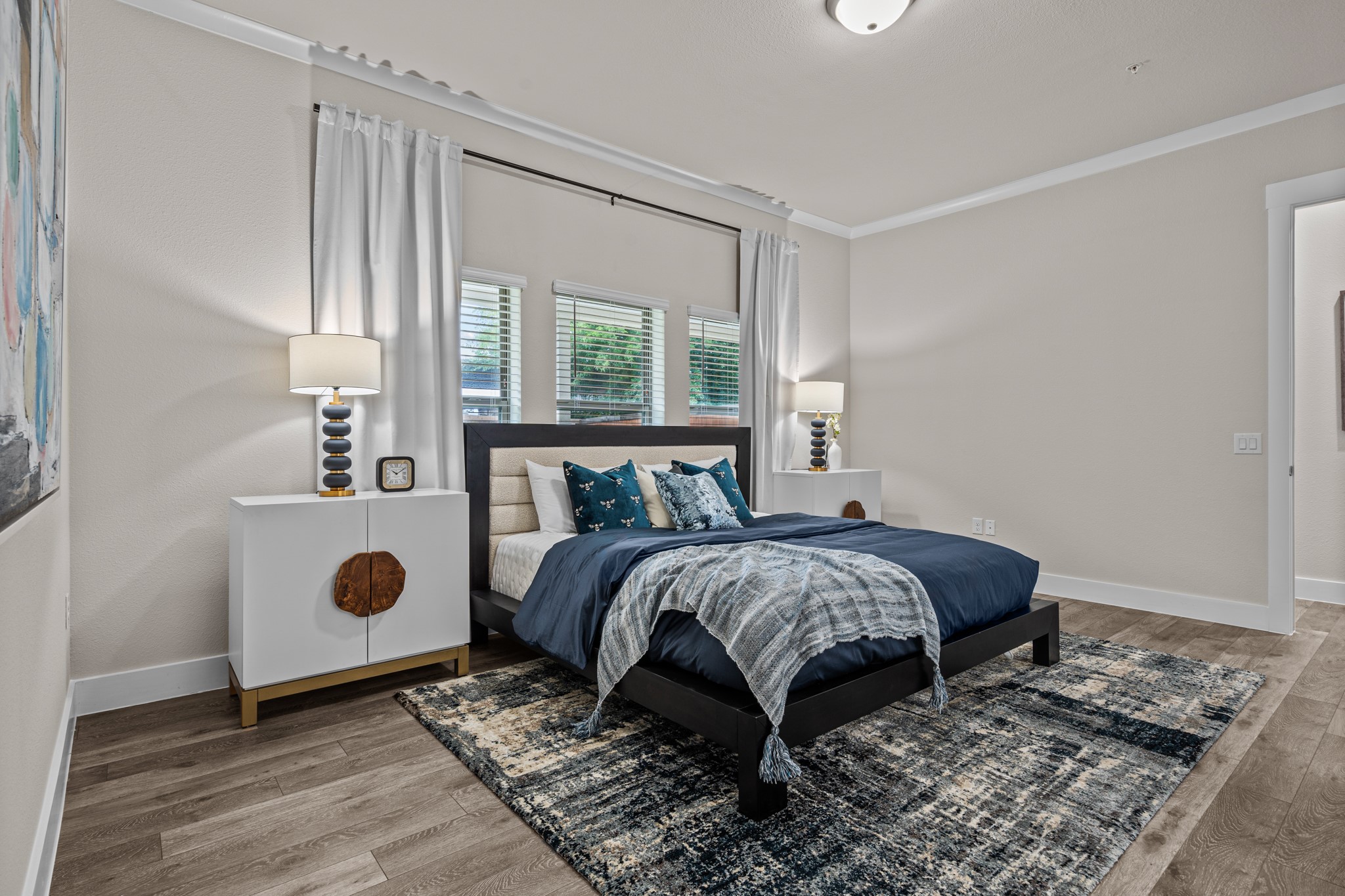 865 Limmer Loop, Unit 1105 Hutto, TX 78634 - Photo 24 of 32 a bedroom with a bed and a window