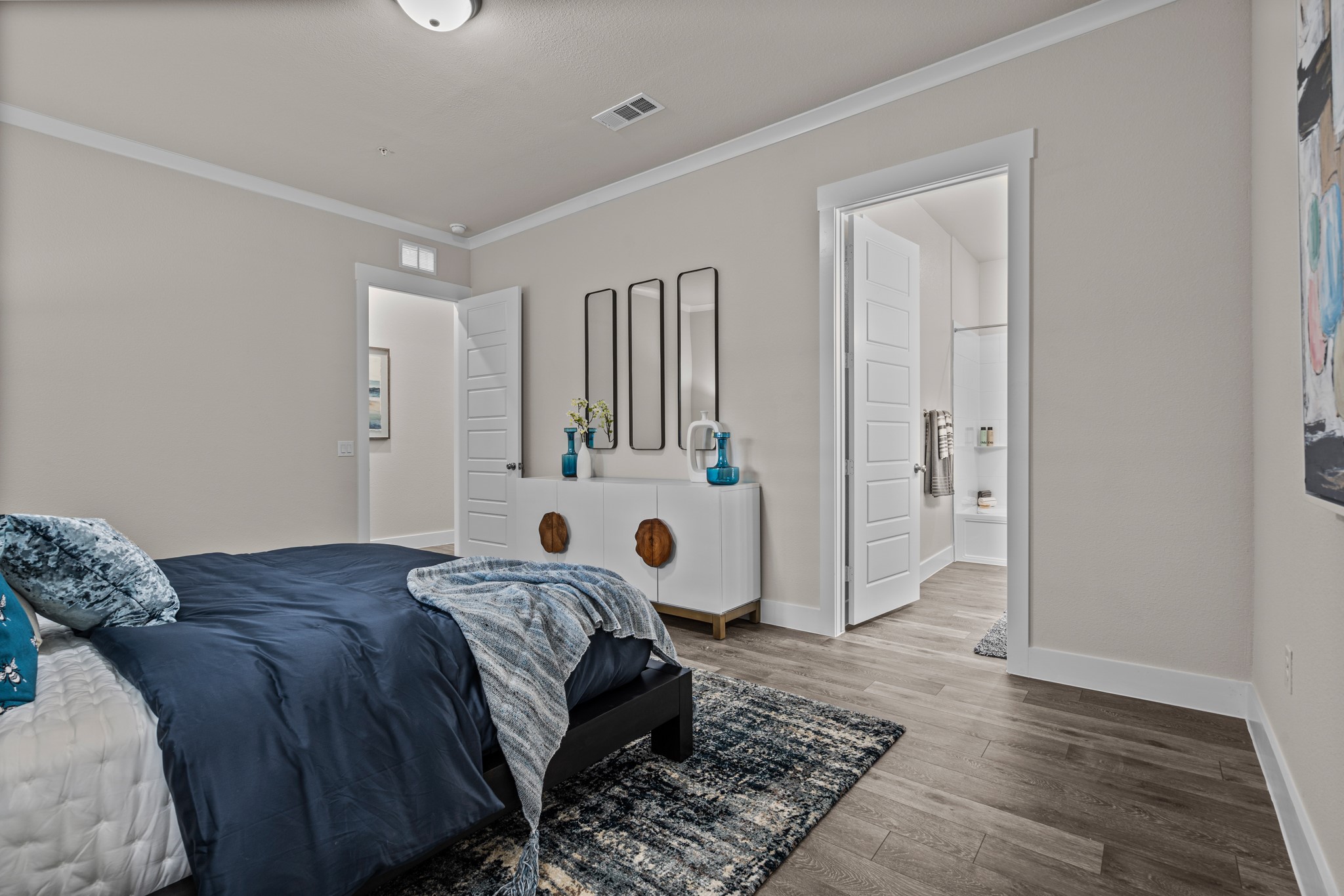 865 Limmer Loop, Unit 1105 Hutto, TX 78634 - Photo 25 of 32 a bedroom with a large bed and a window