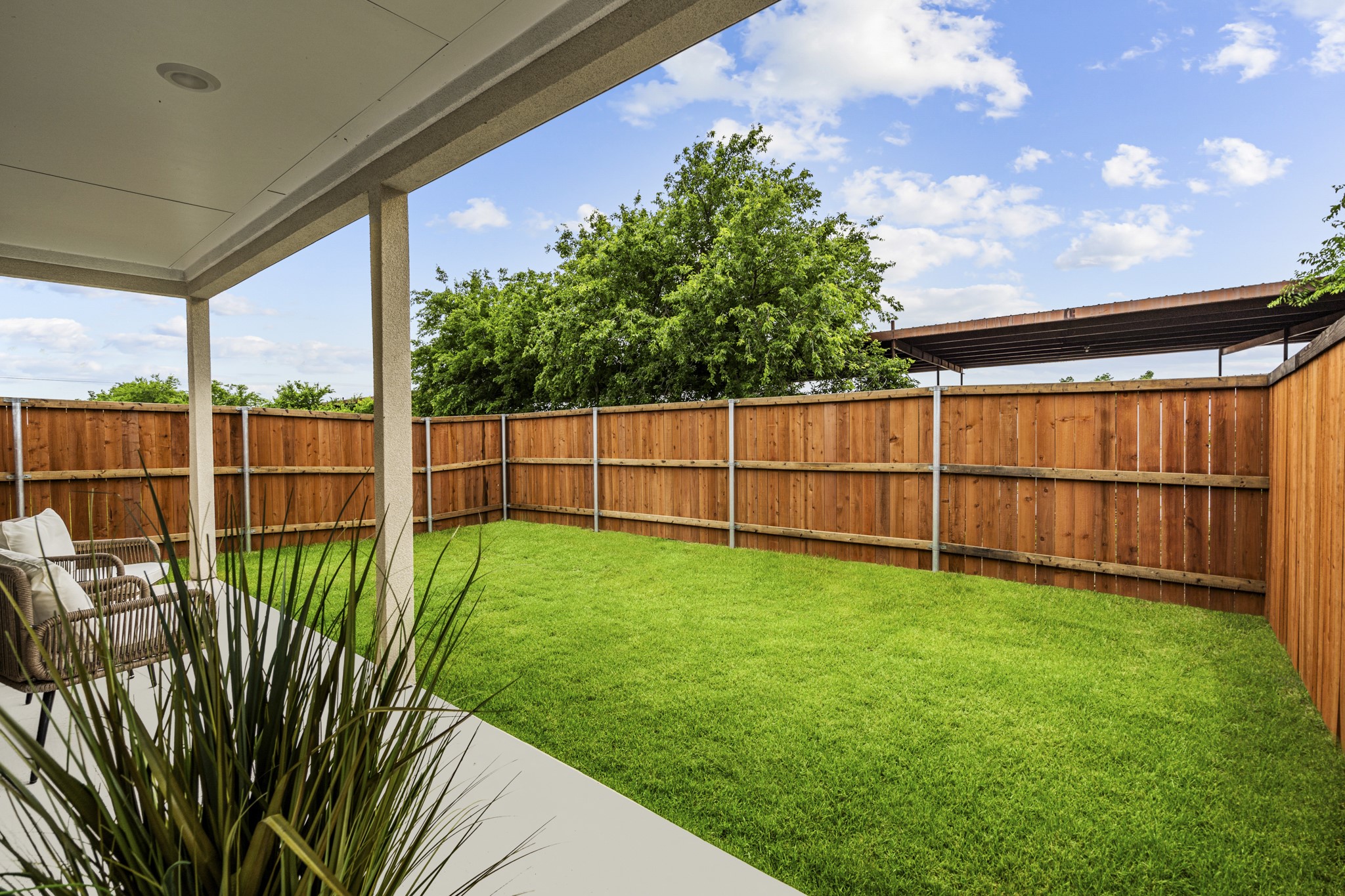 865 Limmer Loop, Unit 1105 Hutto, TX 78634 - Photo 29 of 32 a view of a backyard with a garden