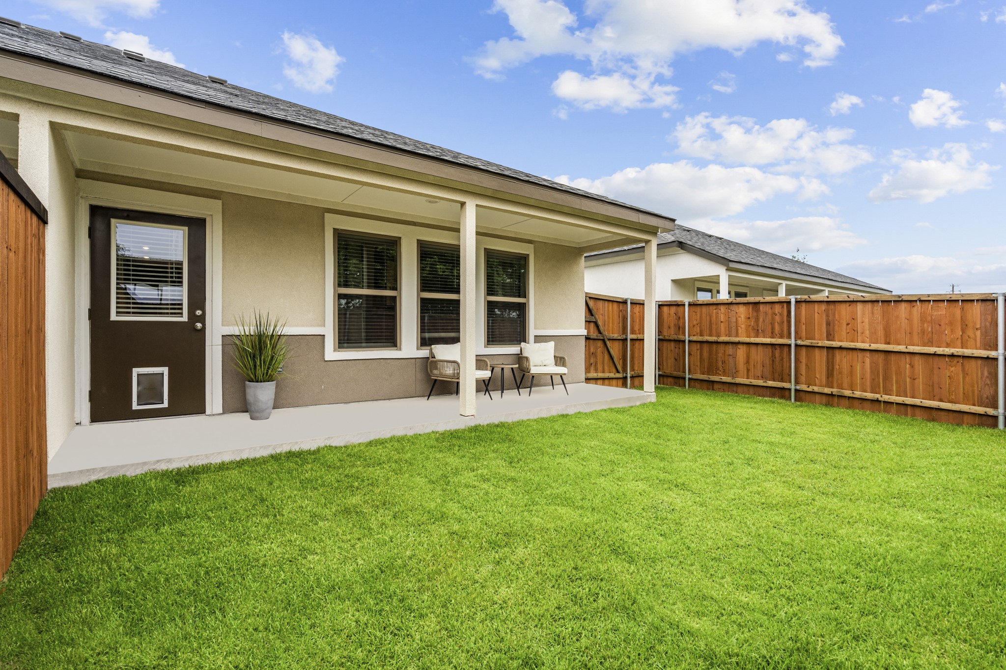 865 Limmer Loop, Unit 1105 Hutto, TX 78634 - Photo 30 of 32 a view of a house with backyard and porch
