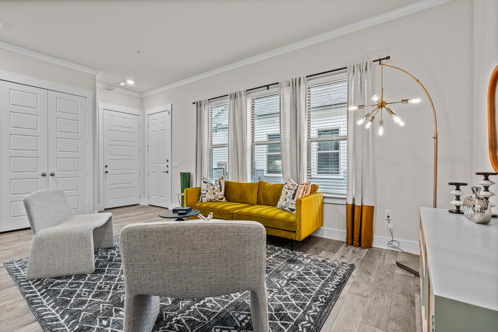 865 Limmer Loop, Unit 1105 Hutto, TX 78634 - Photo 5 of 32 a living room with furniture and wooden floor