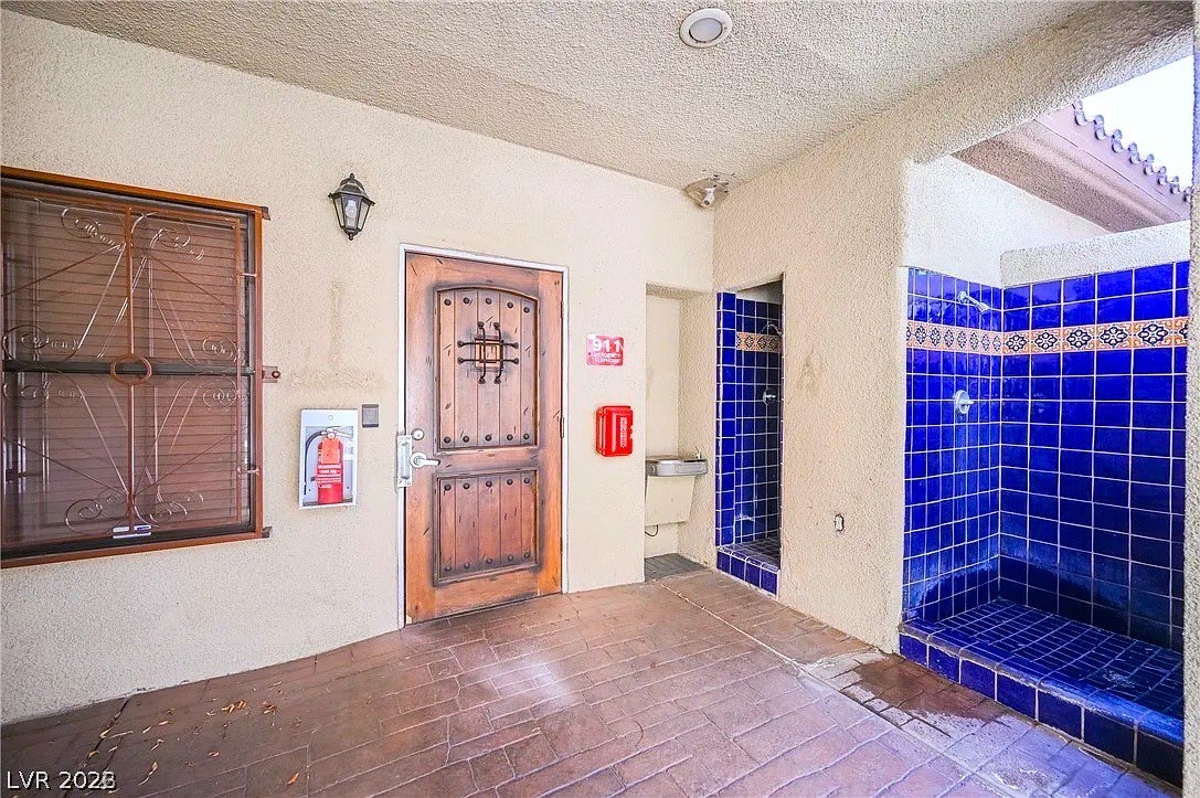 3135 South Mojave Road, Unit 156 Las Vegas, NV 89121 - Photo 17 of 18 Bold blue tiling adds vibrant charm to these outdoor showers, creating a refreshing oasis.