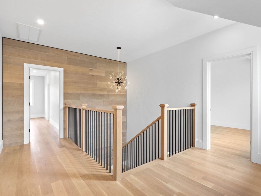 48 Valley View Road Waltham, MA 02452 - Photo 11 of 29 a view of a hallway with wooden floor
